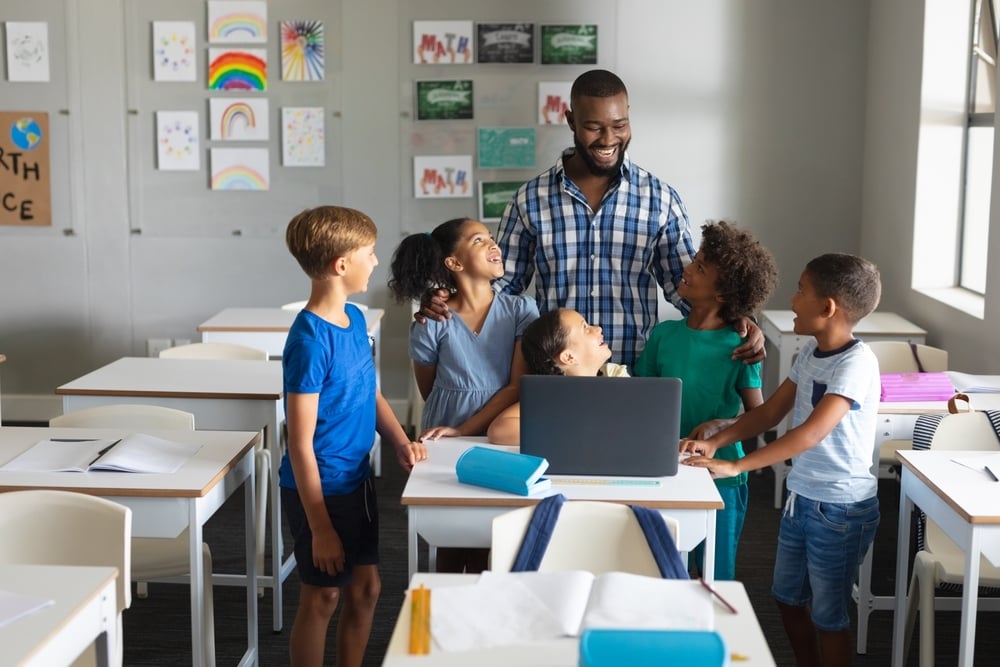 male-teacher-with-five-students